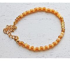 Armband 4mm Miyuki kralen geel-bruin. 17cm + verlengketting