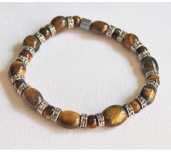Armband Tijgeroog kralen in verschillende grootte met bewerkte tussenkralen