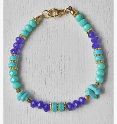 Armband facetgeslepen 6x4mm donkerblauwe en groene opaque kralen. 