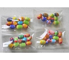 Zakje veelkleurige tube millefiori kralen, per10 stuks. 9x6mm.
