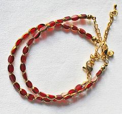 Armband facetgeslepen wijnrood-goudkleurige kralen 5x3mm