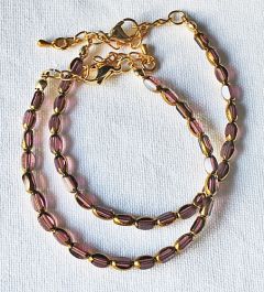 Armband facetgeslepen amethist met goudkleur kralen 5x3mm