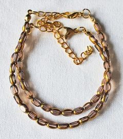 Armband facetgeslepen zacht lila en goudkleur kralen 5x3mm