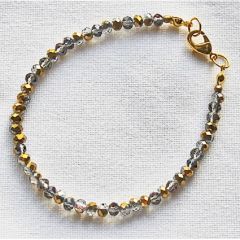 Armband facetgeslepen 4x3mm transparant goudplated kralen