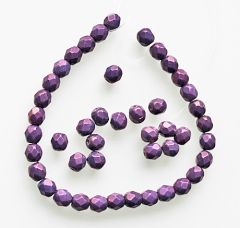 Zakje facetgeslepen firepolished lila luster 6mm kralen met goudglans. Per 30st.