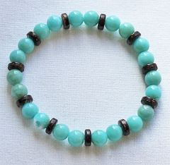 Armband turkoois kleur kralen met cocos schijfjes