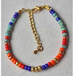 Armband Miyuki 4mm rocailles turkoois, oranje, rood, blauw en goud