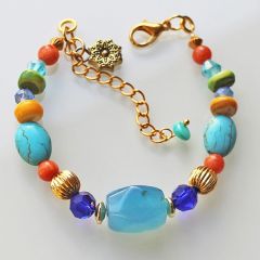 Zomerse armband blauw en goudkleur. 17cm + verlengketting