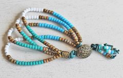 Armband 4 snoeren Miyuki kralen in turkoois, wit, bruin. 19cm.