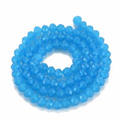 Zakje facetgeslepen helder blauwe 6x5mm rondel, imitatie jade. 50 stuks.