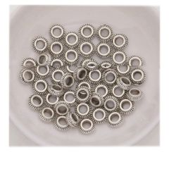 Metalen ronde kraal met ribbeltjes 6.5x2.5mm, per 4 stuks.