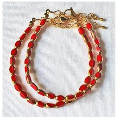 Armband facetgeslepen opaque rode kralen met goudkleur 5x3mm