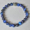 Armband Tijgeroog valkenoog kralen 8mm met uiltje. 19cm.