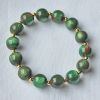 Armband 12mm resin kralen, groen gevlamd
