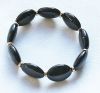 Armband grote ovalen kralen zwart, 17-19cm