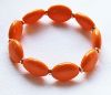 Armband grote ovalen kralen opaque creme-oranje, 16-18cm