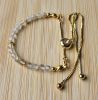 Armband facetgeslepen 4mm goudkwarts met rvs schuifknoop