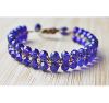 Armband dubbele rij 4mm facetgeslepen blauwe kralen met schuifknoop sluiting. 