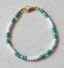 Armband Miyuki kralen 4mm, turkoois, wit en goudkleur. 18cm.