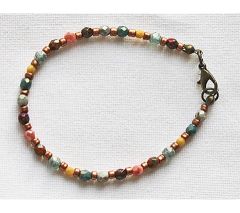 Armband kleine facetgeslepen opaque kraaltjes