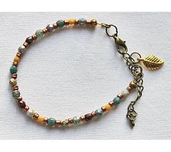 Armband kleine opaque facetgeslepen kraaltjes met verlengketting