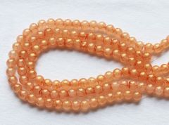 Snoer 8mm licht koraal oranje ronde kralen met glitter, 40 stuks