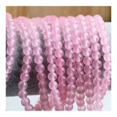 Snoer Jade roze kralen, iets transparant, 6mm. 50 stuks.