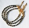 Armband facetgeslepen zwart-goudkleurige kralen 5x3mm
