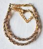 Armband facetgeslepen zacht lila en goudkleur kralen 5x3mm