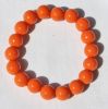 Armband oranje 12mm kralen, 18-19cm.