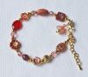 Armband tsjechische bloemen en facetgeslepen rode en roze kralen