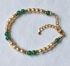 Armband glaspareltjes en groene glaskralen, 19cm.